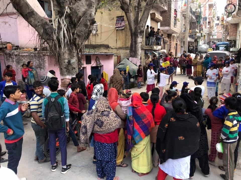 Community awareness activity with residents and volunteers